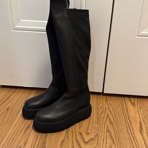 Brand new European knee high platform boot.